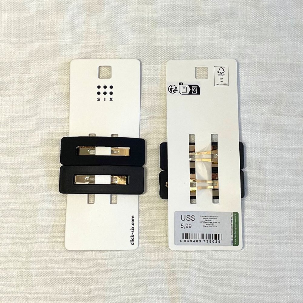 SIX pair of black hair clips